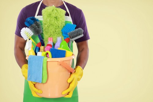 Cleaner using safe procedures with protective equipment