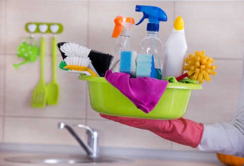 Professional carpet cleaner treating a living room carpet in Finchley