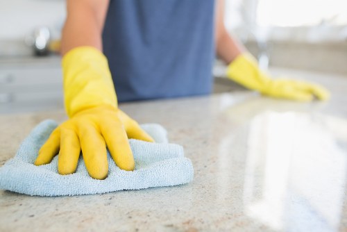 Professional cleaner maintaining shared stairwell areas in Finchley